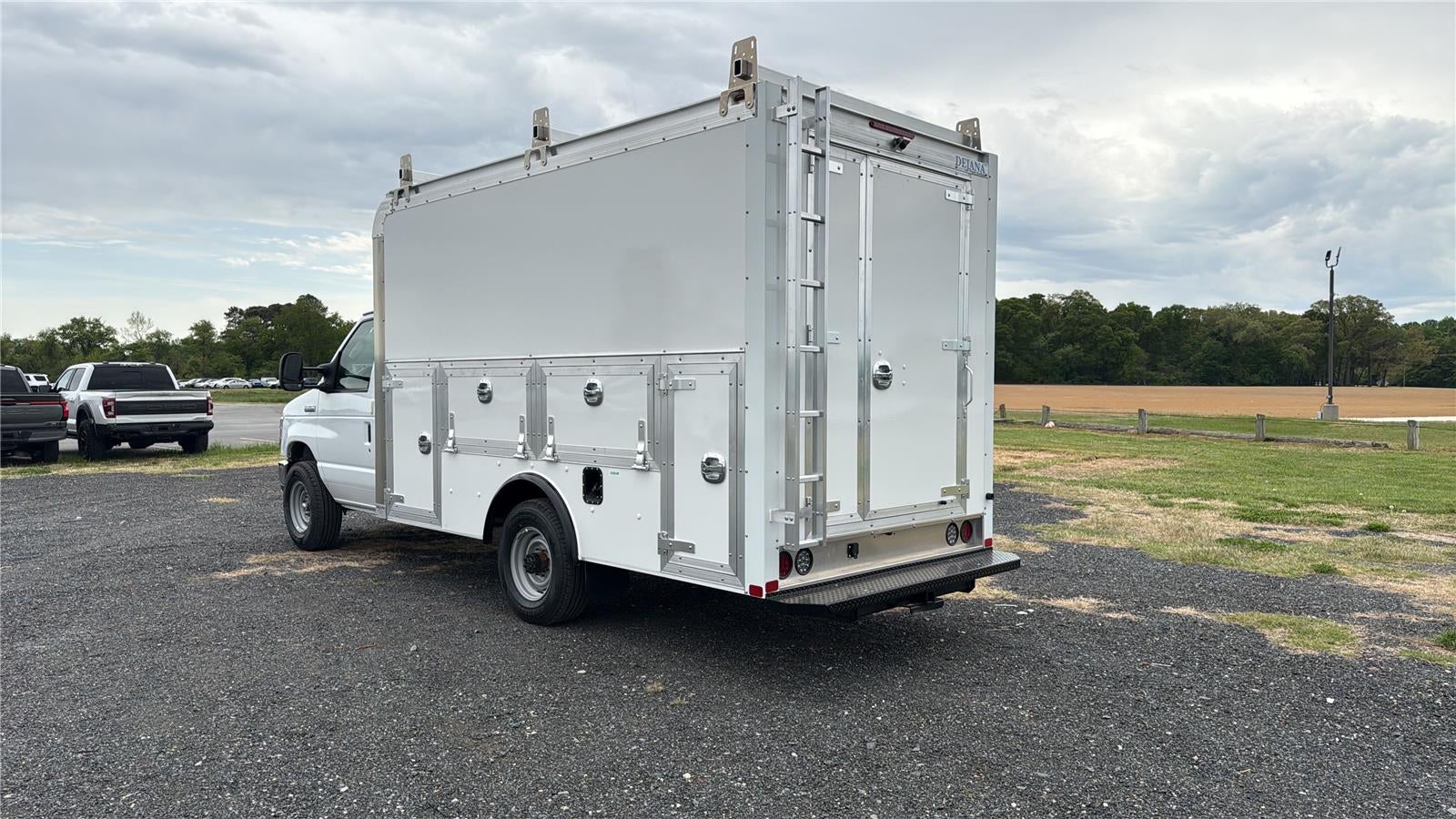 2027 Ford E-Series Cutaway 12' DURA-CUBE MAX FRP ENCLOSED SERVICE BODY, POWER LOCKS, 3 BOX LADDER RACK, BACK UP CAMERA